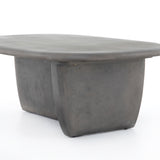 Featuring Naya Outdoor Coffee Table by Four Hands at Amethyst Home. This Naya Outdoor Coffee Table is modern and curve-driven. Dark grey concrete forms a rounded rectangle top with bullnose edging, reminiscent of a shapely surfboard.  Cover or store inside during inclement weather.
Overall Dimensions: 46"W x 28"L x 16"HColors: Dark GreyMaterials: ConcreteWeigh.  Amethyst Home provides interior design, new home construction design consulting, vintage area rugs, and lighting in the Omaha metro area.