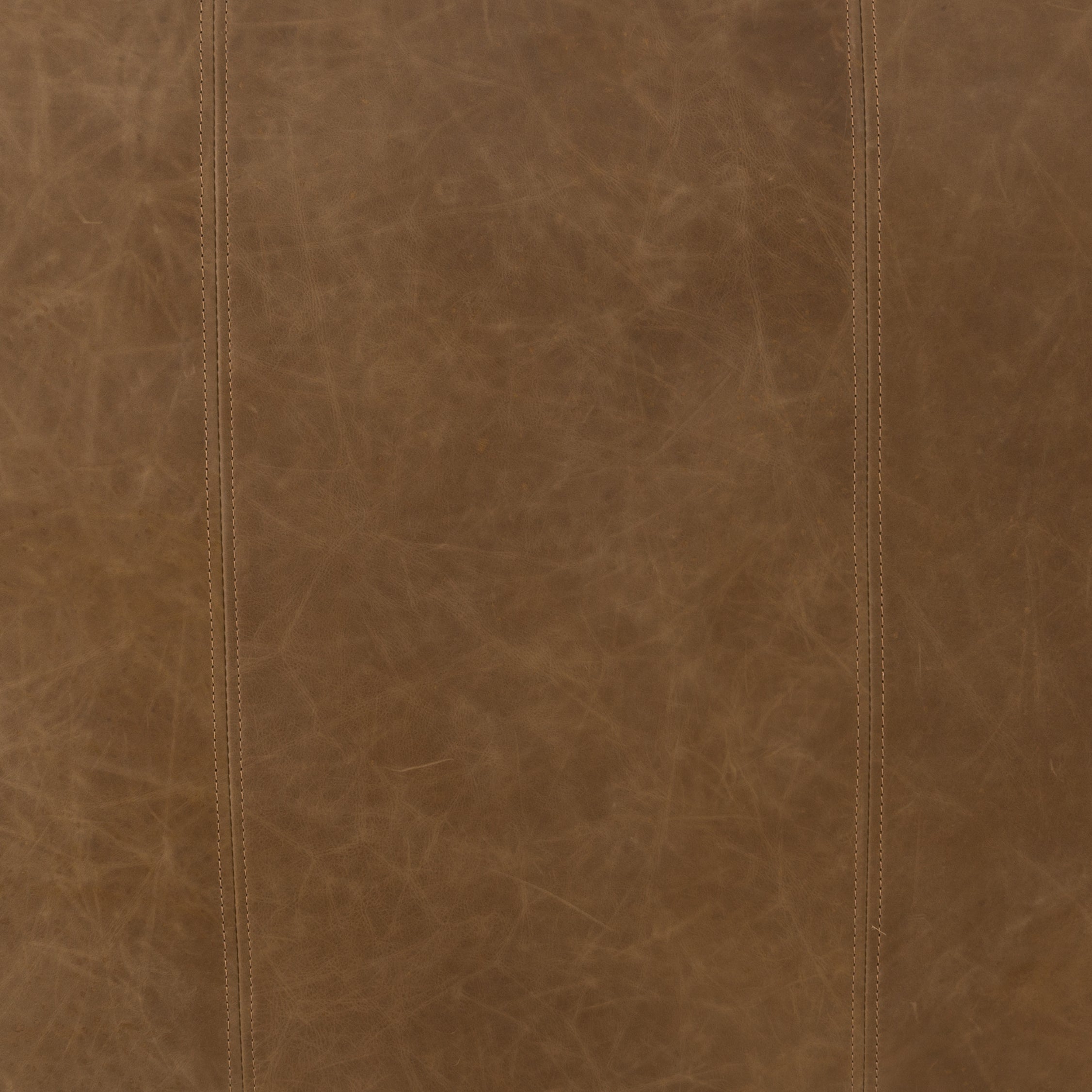 Featuring Nolita Reverse Stitch Sofa - Natural Washed Sand by Four Hands at Amethyst Home. Sophisticated Italian styling with distinctly casual appeal is found in this Nolita Reverse Stitch Sofa - Natural Washed Sand. Top-grain leather takes on a natural sand color with contrast stitching along the welt, sure to elevate the space for any living room. 
Overall .  Amethyst Home provides interior design, new home construction design consulting, vintage area rugs, and lighting in the Miami metro area.