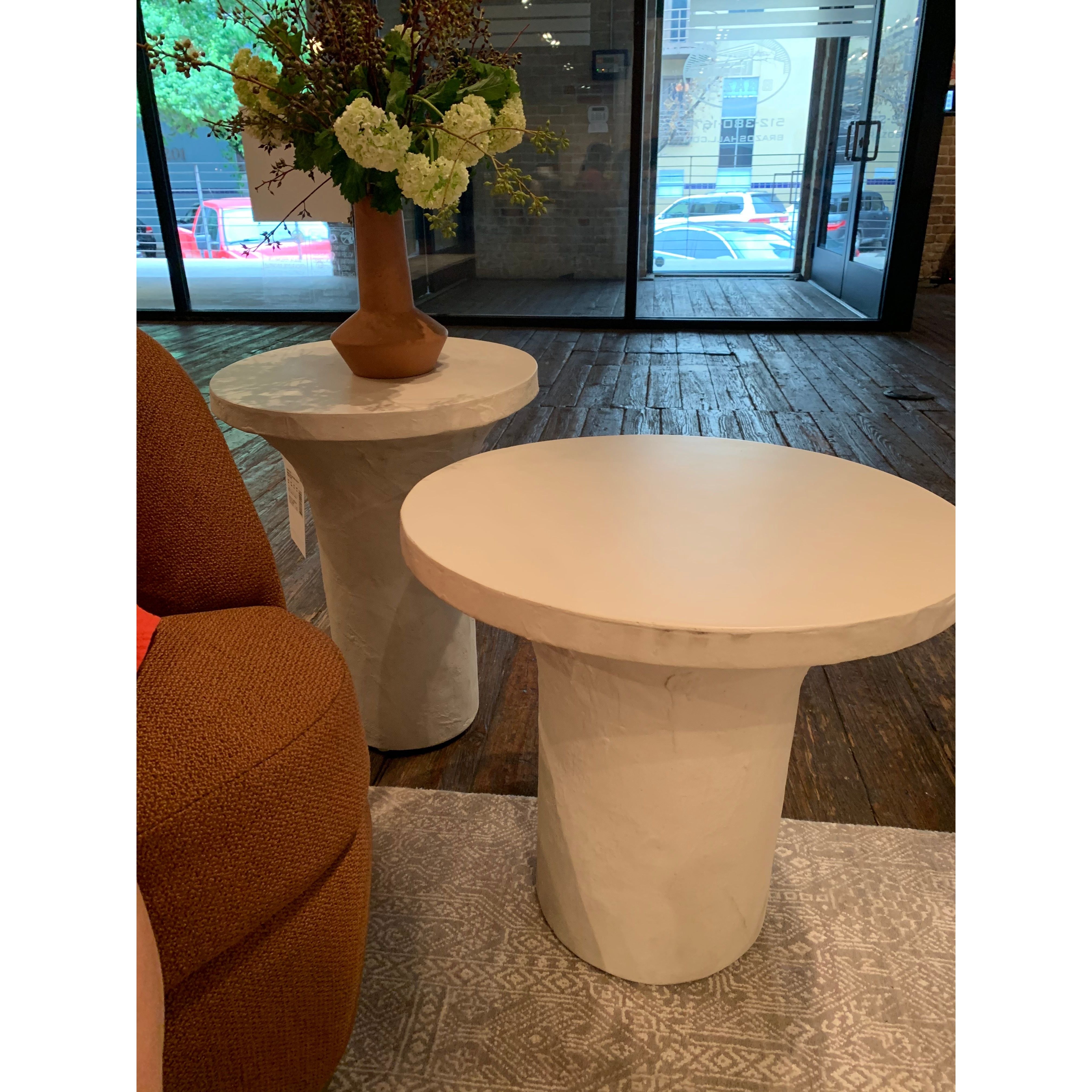 Featuring Parra Low End Table - Plaster Molded Concrete by Four Hands at Amethyst Home. Made from plaster-molded concrete, a pedestal-style base supports a rounded tabletop of smooth, white-finished concrete in this Parra Low End Table - Plaster Molded Concrete. This brings a clean, adobe-inspired vibe to any living room or lounge area. Pair with the matching .  Amethyst Home provides interior design, new home construction design consulting, vintage area rugs, and lighting in the Tampa metro area.
