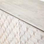 Featuring Rio Media Console - Round Cut White Wash by Four Hands at Amethyst Home. We love the texture of this Rio Media Console - Round Cut White Wash. Made from solid mango with spacious interior shelving and a rear cutout for card management, this is a beautiful piece to add to any living room or entertainment area. 
Overall Dimensions: 82"W x 18.25"L x 2.  Amethyst Home provides interior design, new home construction design consulting, vintage area rugs, and lighting in the Houston metro area.