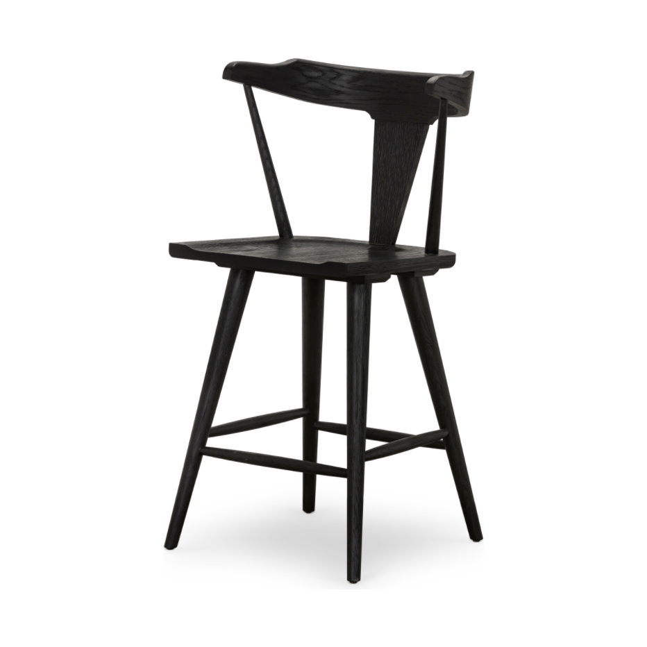 Featuring Ripley Black Oak Bar + Counter Stool by Four Hands at Amethyst Home. A fresh, bar-style take on mid-century Windsor seating is found in this Ripley Black Oak Bar + Counter Stool. Featuring a bowed, sculptural silhouette and soft black finish to highlight the natural grain of weathered oak.
Bar Overall Dimensions: 20.50"W x 20"L x 42.25"HSeat Dept.  Amethyst Home provides interior design, new home construction design consulting, vintage area rugs, and lighting in the Charlotte metro area.