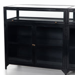 Featuring Shadow Box Sideboard - Black by Four Hands at Amethyst Home. This Shadow Box Sideboard gives your inner collector a place to play. Store prized possessions behind clear glass fronts, with black-finished metal casing and brass hardware for contrast.
Overall Dimensions: 70"W x 17.25"L x 35"H
Colors: Black, Weathered Bronze, Clear Glass, Tempered G.  Amethyst Home provides interior design, new home construction design consulting, vintage area rugs, and lighting in the Washington metro area.