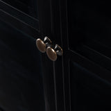 Featuring Shadow Box Sideboard - Black by Four Hands at Amethyst Home. This Shadow Box Sideboard gives your inner collector a place to play. Store prized possessions behind clear glass fronts, with black-finished metal casing and brass hardware for contrast.
Overall Dimensions: 70"W x 17.25"L x 35"H
Colors: Black, Weathered Bronze, Clear Glass, Tempered .  Amethyst Home provides interior design, new home construction design consulting, vintage area rugs, and lighting in the Los Angeles metro area.