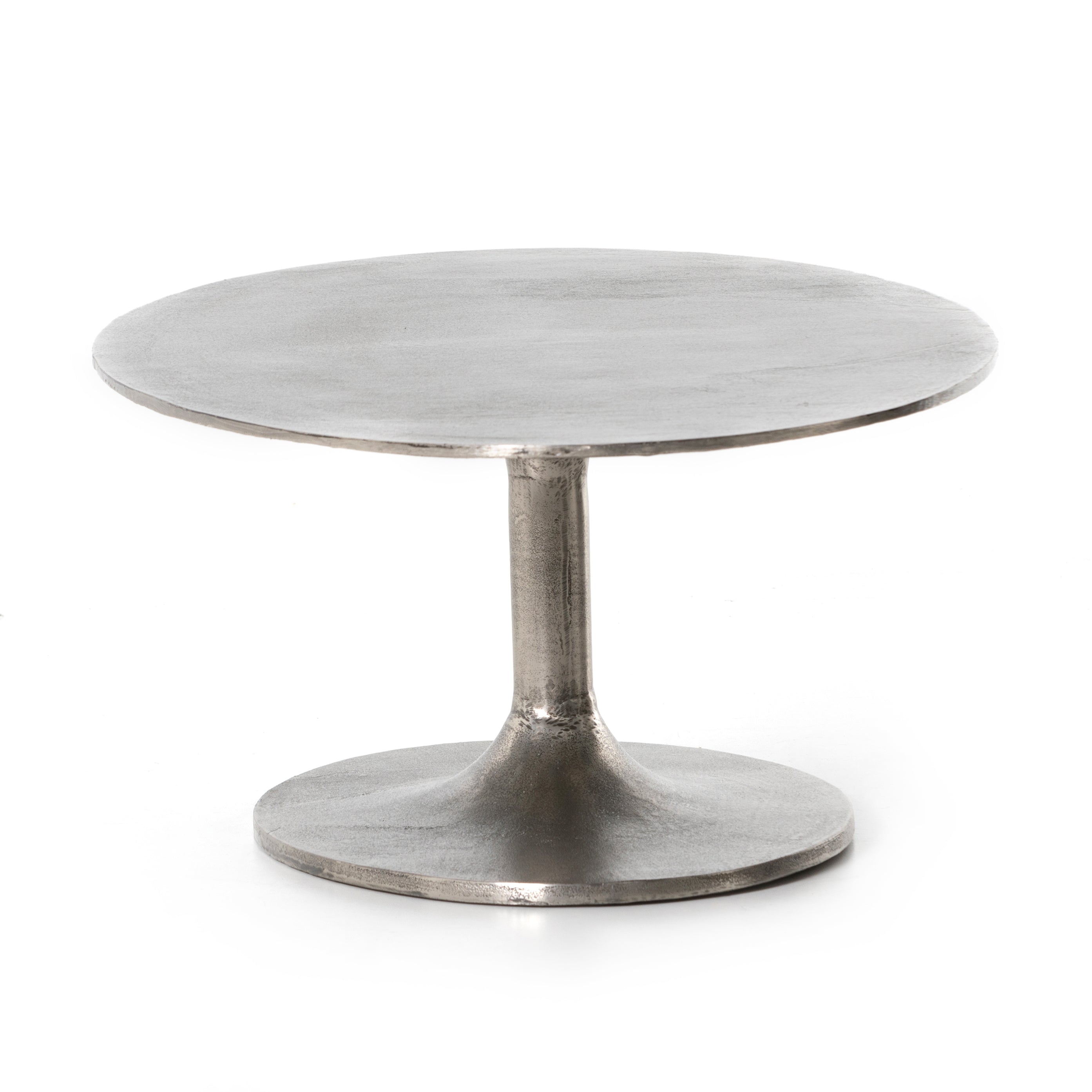 Featuring Simone Coffee Table - Antique Nickel by Four Hands at Amethyst Home. We love the oval shape of this Simone Coffee Table - Antique Nickel. The textural cast aluminum makes for a beautifully modern coffee table, with alluring highs and lows played up by a raw nickel finish.  Great indoors or out; cover or store indoors during inclement weather a.  Amethyst Home provides interior design, new home construction design consulting, vintage area rugs, and lighting in the Laguna Beach metro area.