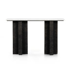 Featuring Terrell Console Table - Raw Black by Four Hands at Amethyst Home. Finished in a raw black, uniquely angular cast aluminum legs, this Terrell Console Table - Raw Black showcases a rectangular tabletop of solid marble in a clean, polished white. We'd love to see this in an entryway or behind a sofa. 
Overall Dimensions: 51"W x 17"L x 31.25"H
Colors:.  Amethyst Home provides interior design, new home construction design consulting, vintage area rugs, and lighting in the Portland metro area.