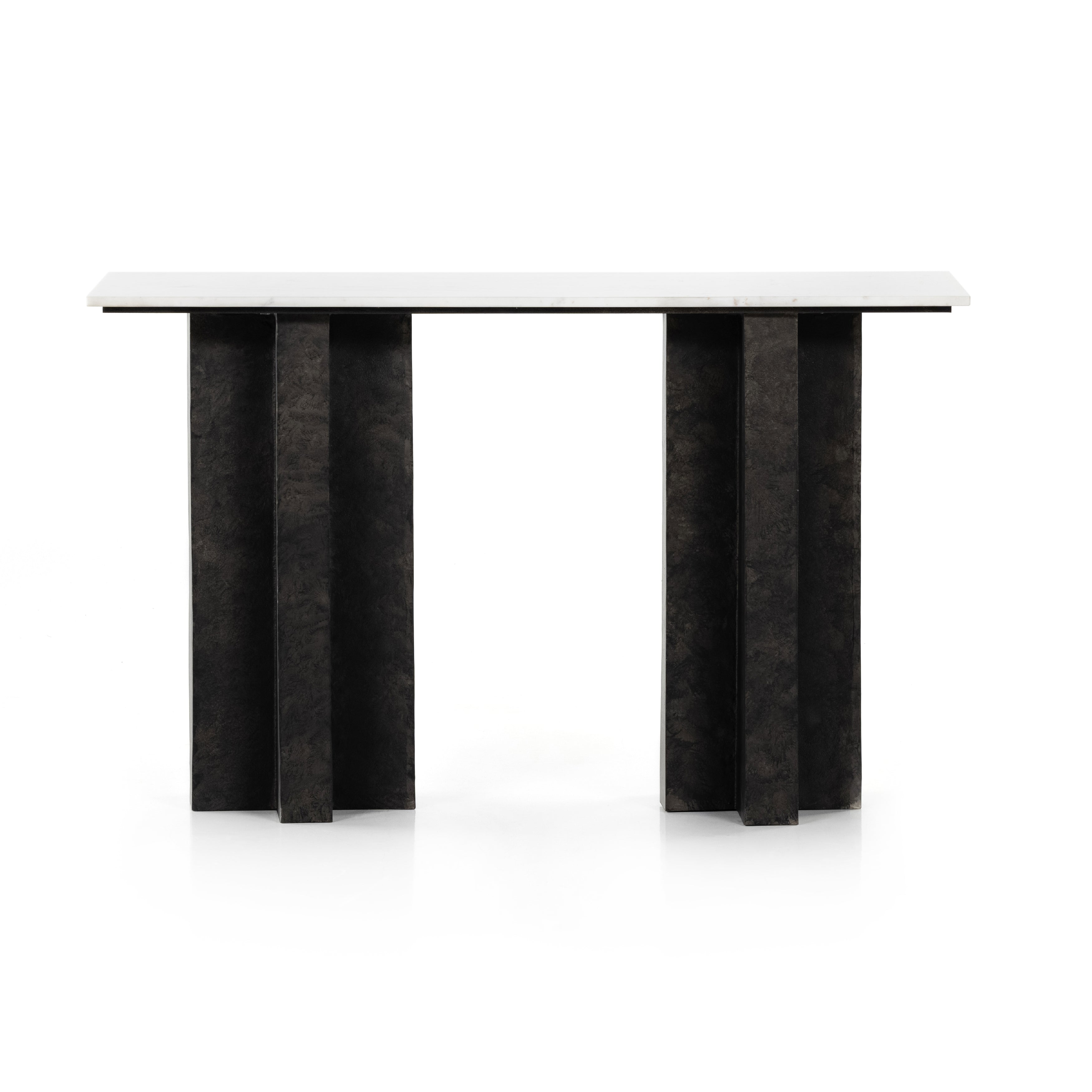 Featuring Terrell Console Table - Raw Black by Four Hands at Amethyst Home. Finished in a raw black, uniquely angular cast aluminum legs, this Terrell Console Table - Raw Black showcases a rectangular tabletop of solid marble in a clean, polished white. We'd love to see this in an entryway or behind a sofa. 
Overall Dimensions: 51"W x 17"L x 31.25"H
Colors:.  Amethyst Home provides interior design, new home construction design consulting, vintage area rugs, and lighting in the Portland metro area.