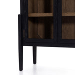 Featuring Tolle Cabinet - Drifted Matte Black by Four Hands at Amethyst Home. The original and signature two tone solid oak cabinet! Carefully crafted on stiletto legs, our clients enjoy its stunning wood grain look.
Overall Dimensions: 38"W x 19"L x 84"HColors: Antique Brass, Drifted Black, Drifted Oak SolidMaterials: Iron, Solid OakWeight: 185.3 lbVolume.  Amethyst Home provides interior design, new home construction design consulting, vintage area rugs, and lighting in the Charlotte metro area.