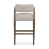 Featuring Waldon Counter Stool by Four Hands at Amethyst Home. Slim, sculptural style with this Waldon Counter Stool. Angular framing features a mix of bronze-finished metal and solid rubberwood, for a forward-thinking feel. Textural linen-blend seating adopts an invitingly neutral grey hue to move freely between spaces and styles.
Size: 23.25"W x 24.50"L .  Amethyst Home provides interior design, new home construction design consulting, vintage area rugs, and lighting in the Calabasas metro area.