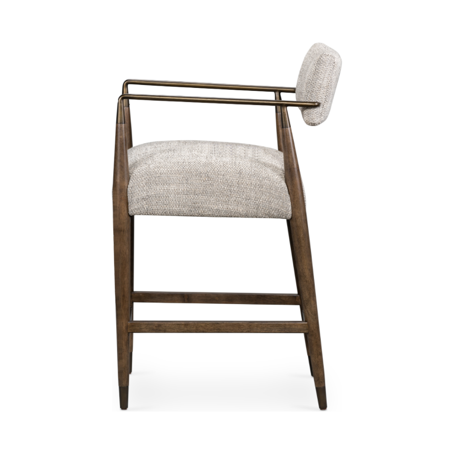 Featuring Waldon Counter Stool by Four Hands at Amethyst Home. Slim, sculptural style with this Waldon Counter Stool. Angular framing features a mix of bronze-finished metal and solid rubberwood, for a forward-thinking feel. Textural linen-blend seating adopts an invitingly neutral grey hue to move freely between spaces and styles.
Size: 23.25"W x 24.50"L.  Amethyst Home provides interior design, new home construction design consulting, vintage area rugs, and lighting in the Washington metro area.