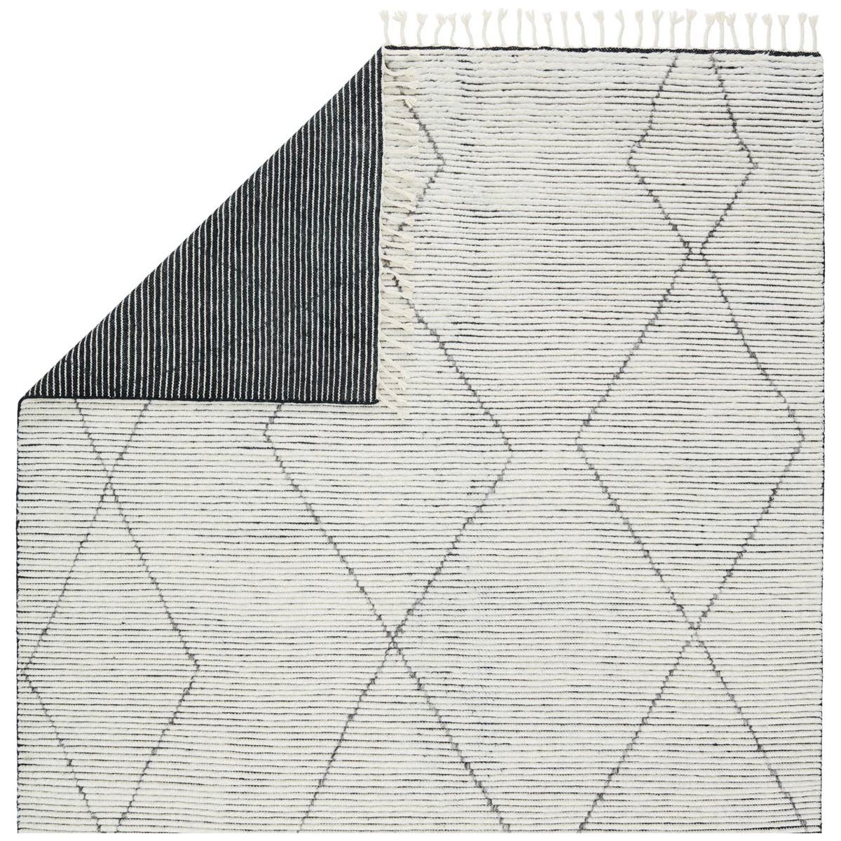 Featuring Alpine Ammil Hand-Knotted Rug by Jaipur Living at Amethyst Home. Inspired by textiles from the Tullu region in Morocco, the Alpine Ammil rug brings texture and versatility to both global and modern spaces. Crafted of natural wool, the hand-knotted Alpine Ammil rug features a plush, ridged feel and an asymmetrical trellis design in cream and blac.  Amethyst Home provides interior design, new home construction design consulting, vintage area rugs, and lighting in the Des Moines metro area.