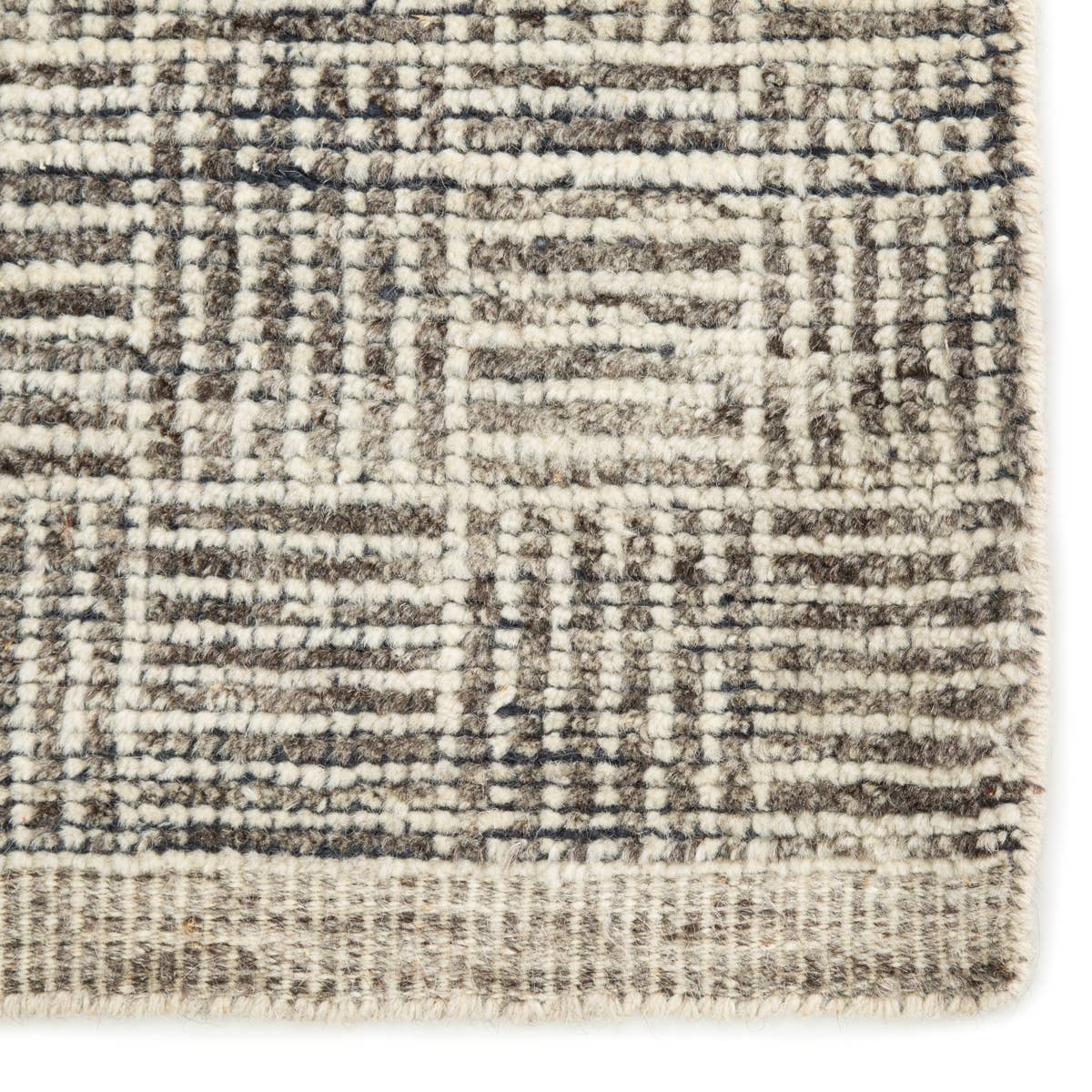 Featuring Rize Mugler Hand-Knotted Rug by Jaipur Living at Amethyst Home. The Rize Mugler Area Rug offers intricate and delicately designed global patterns to the modern home. A thatched square motif creates an eye-catching geometric design on the artistically distressed Mugler area rug. In an earthy ivory and black colorway, this durable hand-knotted wool.  Amethyst Home provides interior design, new home construction design consulting, vintage area rugs, and lighting in the San Diego metro area.
