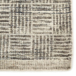 Featuring Rize Mugler Hand-Knotted Rug by Jaipur Living at Amethyst Home. The Rize Mugler Area Rug offers intricate and delicately designed global patterns to the modern home. A thatched square motif creates an eye-catching geometric design on the artistically distressed Mugler area rug. In an earthy ivory and black colorway, this durable hand-knotted wool.  Amethyst Home provides interior design, new home construction design consulting, vintage area rugs, and lighting in the San Diego metro area.