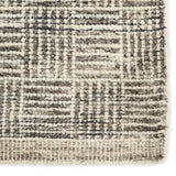 Featuring Rize Mugler Hand-Knotted Rug by Jaipur Living at Amethyst Home. The Rize Mugler Area Rug offers intricate and delicately designed global patterns to the modern home. A thatched square motif creates an eye-catching geometric design on the artistically distressed Mugler area rug. In an earthy ivory and black colorway, this durable hand-knotted wool.  Amethyst Home provides interior design, new home construction design consulting, vintage area rugs, and lighting in the San Diego metro area.