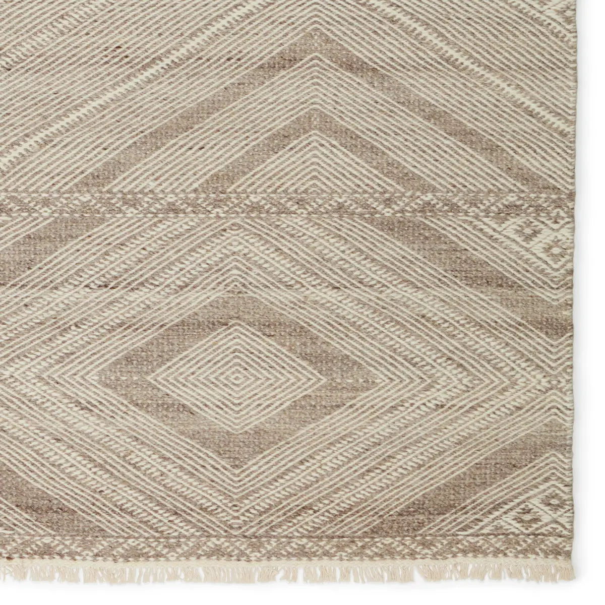 Featuring Satori Suriya Rug by Jaipur Living at Amethyst Home. The handwoven Satori Suriya Area Rug showcases dynamic, global designs with mesmerizing linear details and geometric motifs. The Suriya rug features a versatile, neutral palette and an intricate tribal and diamond pattern. The short fringe detail adds texture to this light brown and cream-colored p.  Amethyst Home provides interior design, new home construction design consulting, vintage area rugs, and lighting in the Tampa metro area.