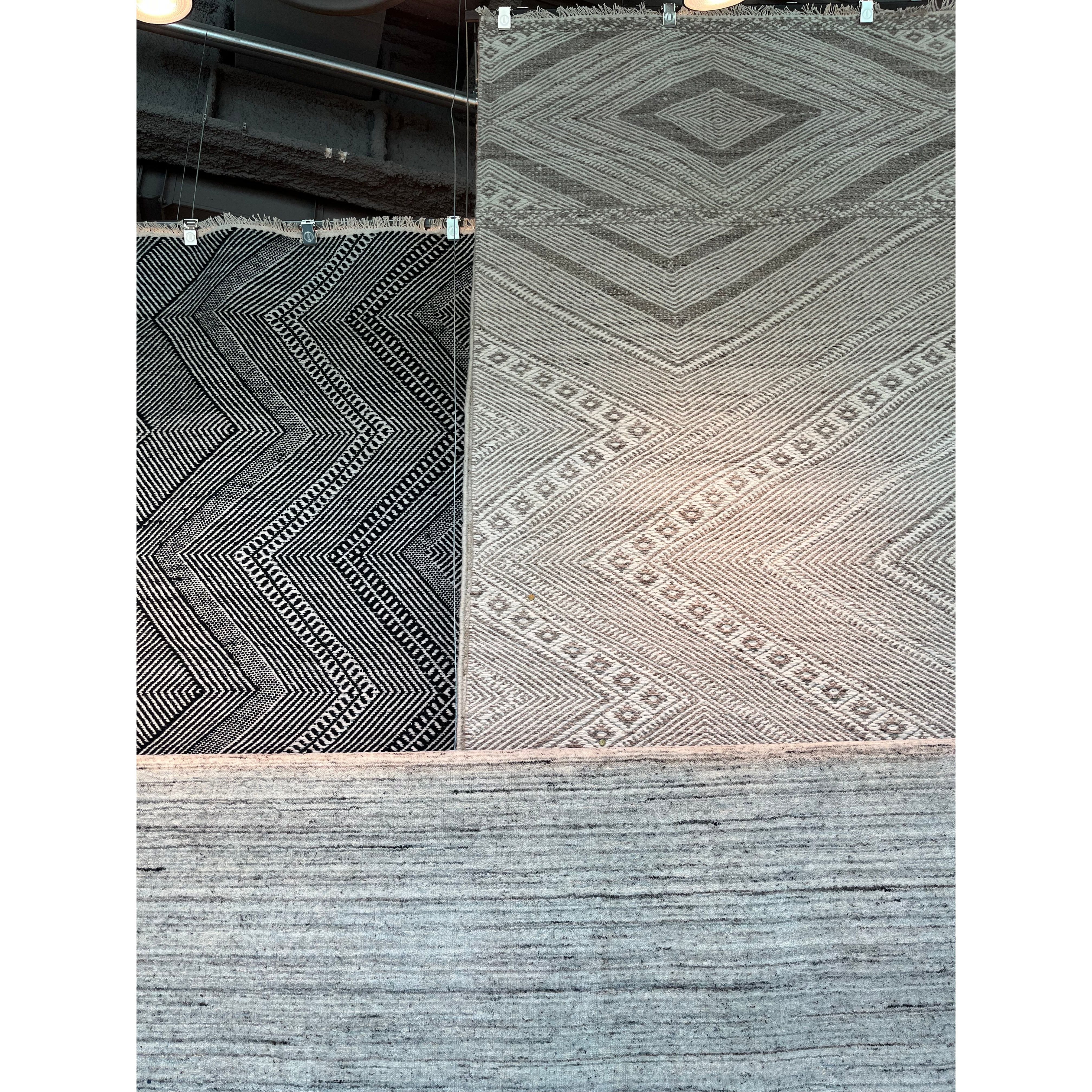 Featuring Satori Suriya Rug by Jaipur Living at Amethyst Home. The handwoven Satori Suriya Area Rug showcases dynamic, global designs with mesmerizing linear details and geometric motifs. The Suriya rug features a versatile, neutral palette and an intricate tribal and diamond pattern. The short fringe detail adds texture to this light brown and cream-colored.  Amethyst Home provides interior design, new home construction design consulting, vintage area rugs, and lighting in the Houston metro area.