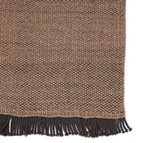 Featuring Sonder Savvy Rug by Jaipur Living at Amethyst Home. The performance-driven Sonder Savvy Area Rug offers a solid, basic design with natural-inspired texture that works for both indoor and outdoor spaces. The handwoven Savvy rug features deep, earthy tones of tan and black for the perfect neutral accent. This rug features a durable, easy-to-clean p.  Amethyst Home provides interior design, new home construction design consulting, vintage area rugs, and lighting in the Calabasas metro area.