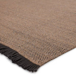 Featuring Sonder Savvy Rug by Jaipur Living at Amethyst Home. The performance-driven Sonder Savvy Area Rug offers a solid, basic design with natural-inspired texture that works for both indoor and outdoor spaces. The handwoven Savvy rug features deep, earthy tones of tan and black for the perfect neutral accent. This rug features a durable, easy-to-clean poly.  Amethyst Home provides interior design, new home construction design consulting, vintage area rugs, and lighting in the Dallas metro area.