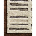 Featuring Bennett Ivory / Charcoal Hand-Knotted Rug by Loloi at Amethyst Home. Dimensional yet soft, the Bennett Ivory / Charcoal Area Rug is hand-knotted of wool, viscose and polyester in India. Featuring a new carve like high-low pile, Bennett has an ivory base with abstract tonal designs. Plus, it's plush underfoot -- a great choice for your office, bedr.  Amethyst Home provides interior design, new home construction design consulting, vintage area rugs, and lighting in the Portland metro area.