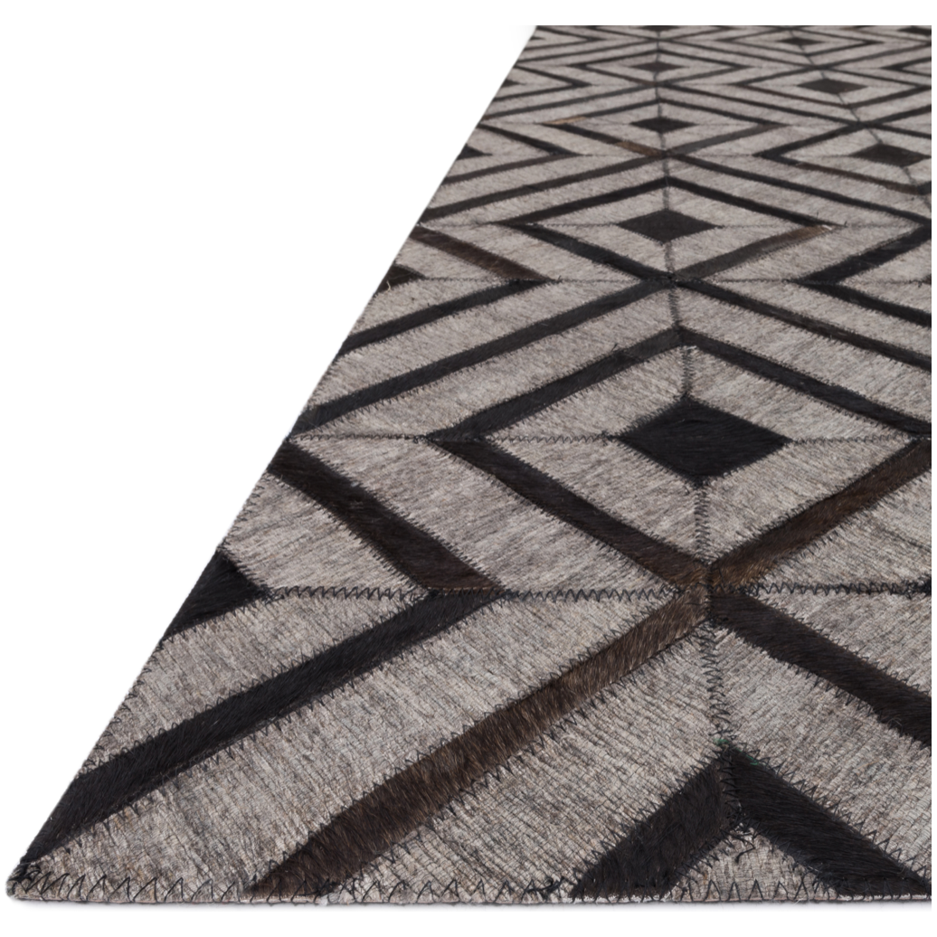 Featuring Dorado Beige/Espresso Rug by Loloi at Amethyst Home. The Dorado Beige/Espresso rug from India features an intriguing combination of hand stitched authentic cowhide and hand woven viscose for a look that's at once bold and unexpected. Available in four sizes including a runner.
Hand-StitchedFront: Textile Part: 62% Rayon | 34% Wool | 4% Other FibersNo.  Amethyst Home provides interior design, new home construction design consulting, vintage area rugs, and lighting in the Miami metro area.