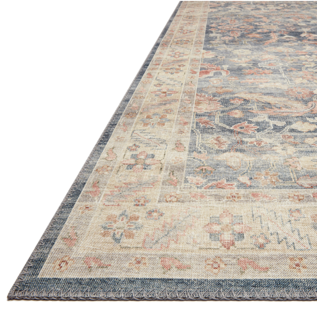 Featuring Hathaway Denim/Multi Rug by Loloi at Amethyst Home. Featuring soft motifs in a carefully curated color palate of blue, yellow, red, and hints of orange, the Hathaway Denim / Multi area rug captures the essence of one-of-a-kind vintage or antique area rug at an attractive price.
This rug is ideal for high traffic areas due to the rug's power-loom.  Amethyst Home provides interior design, new home construction design consulting, vintage area rugs, and lighting in the Des Moines metro area.