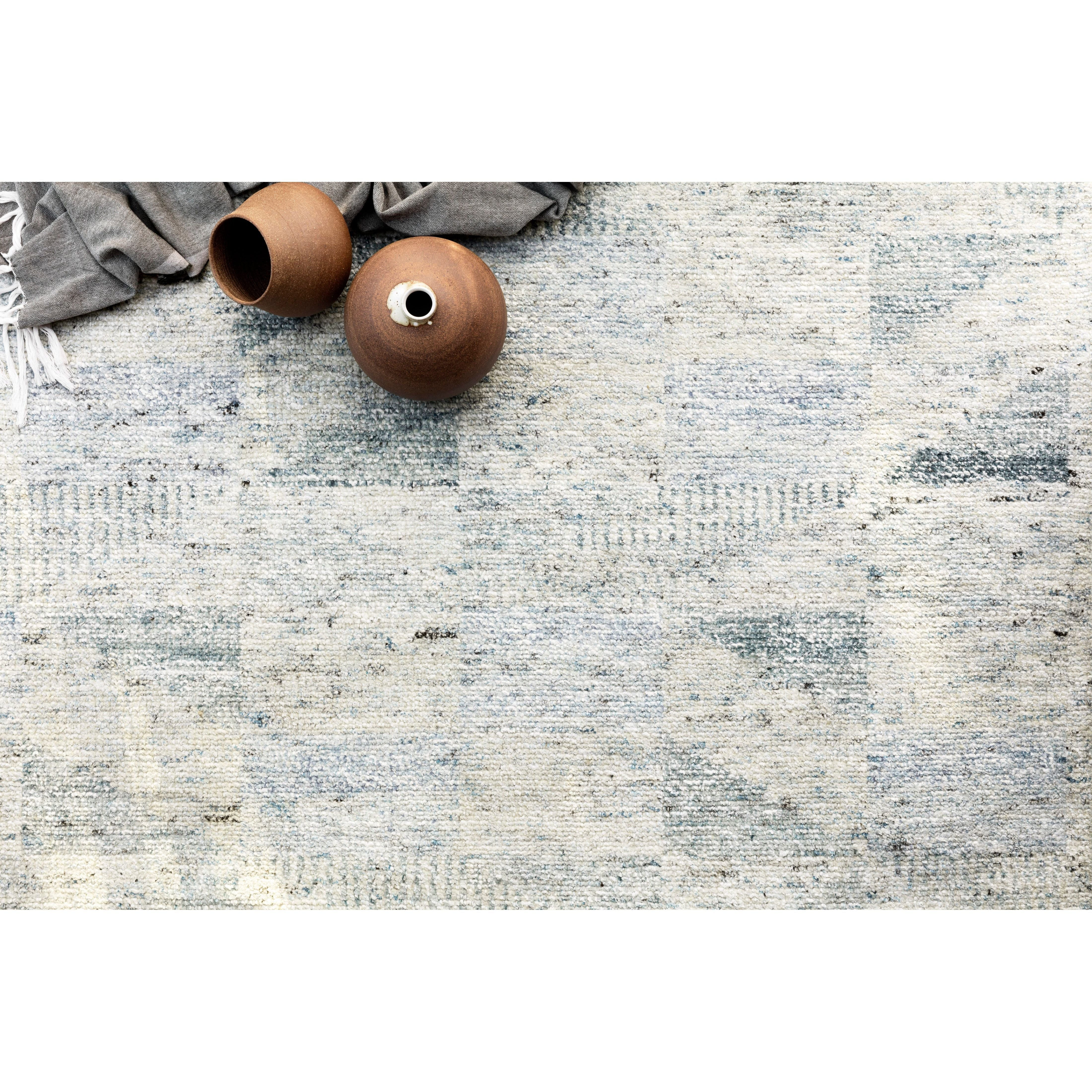 Drawing inspiration from tribal influences, the Odyssey Light BlueArea Rug combines relaxed linear pattern with a sophisticated color palette. Each Odyssey area rug, which is hand knotted of wool, viscose, and cotton, is crafted entirely by hand by master artisans in India. Hand Knotted 70% Viscose from Bamboo | 30% Wool OD-06 Light Blue