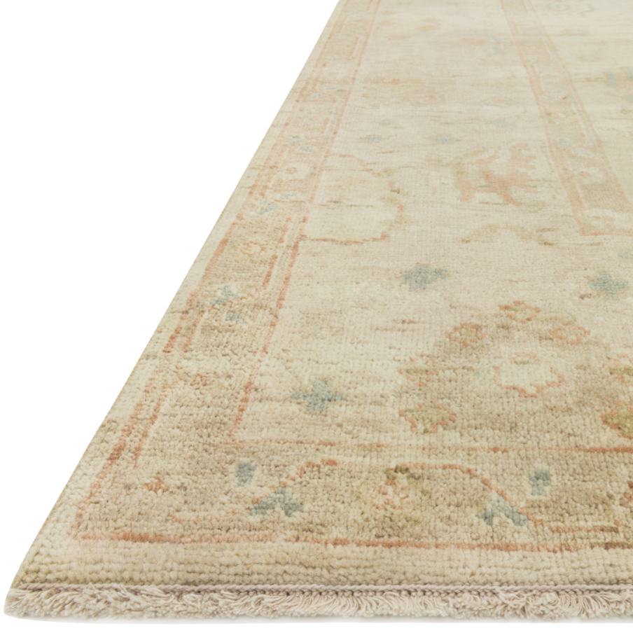 Hand knotted of 100% wool by skilled artisans, the Loloi Vincent Pebble / Pebble Area Rug, or VC-06, offers the look of a well-worn antique rug in a modern day color palette. Each exquisite piece undergoes a weeks-long antique washing process which fades the pattern and color beautifully.