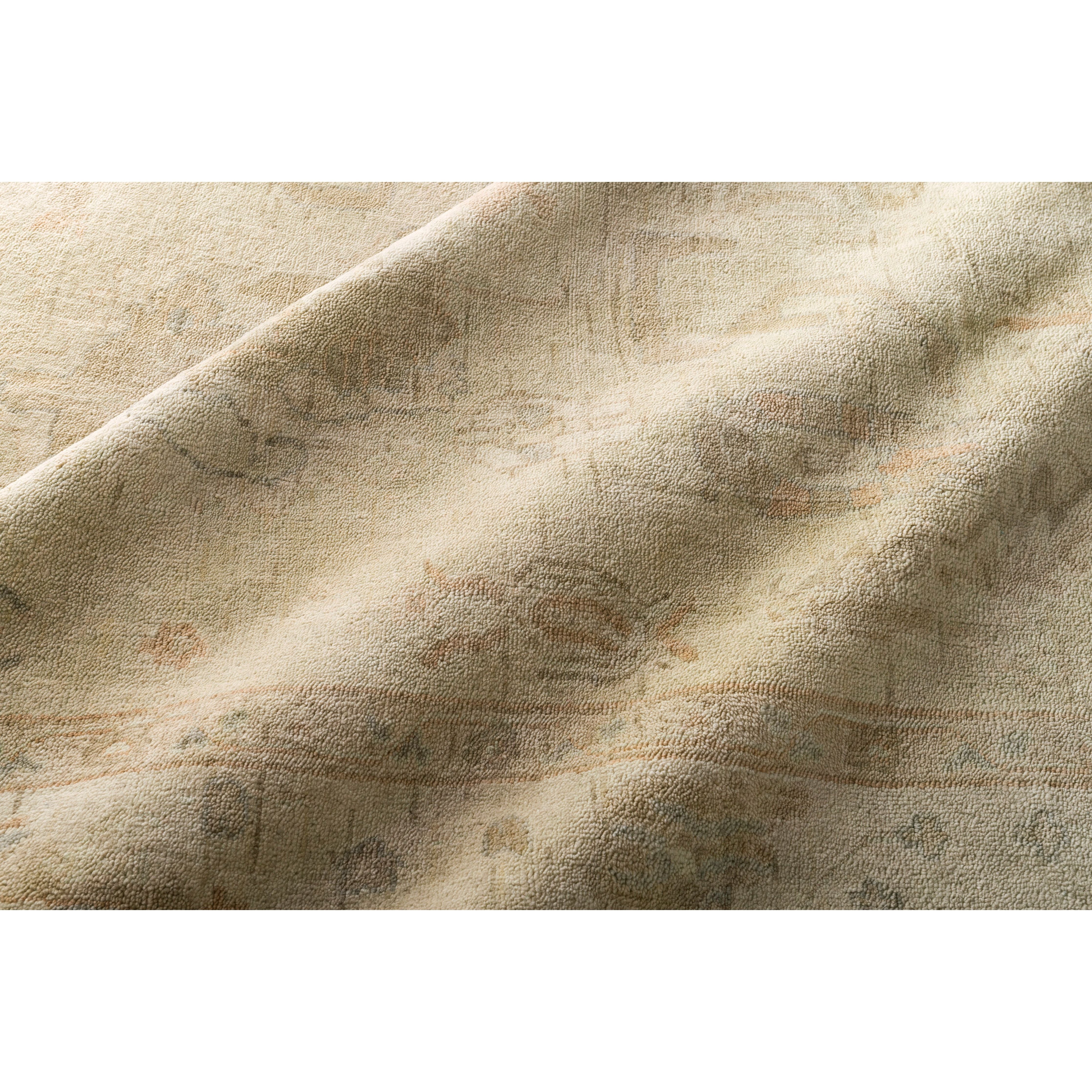 Hand knotted of 100% wool by skilled artisans, the Loloi Vincent Pebble / Pebble Area Rug, or VC-06, offers the look of a well-worn antique rug in a modern day color palette. Each exquisite piece undergoes a weeks-long antique washing process which fades the pattern and color beautifully.
