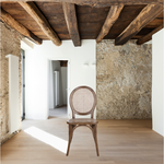 With its classy yet laid back look, the brown Rivalto Dining Chair is designed for a bohemian or mid-century modern home. Its organic design is made from genuine rattan and solid elm wood for a lifelong construction.  Size: 17.7"W x 16.5"D x 37"H"