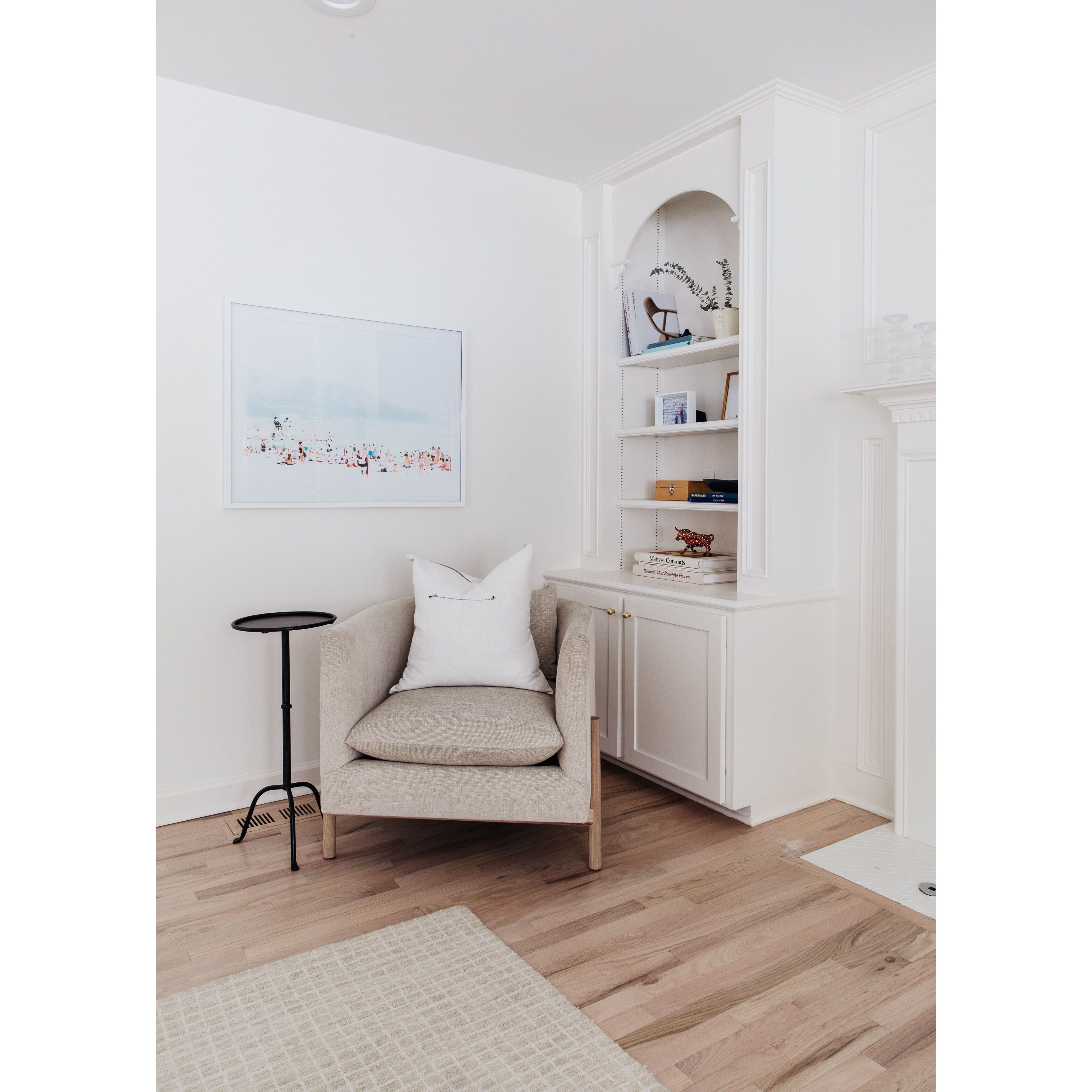 A piece we lovingly refer to as the "three legged-dog" to our clients, the Sullivan chair from Verellen is a beautiful statement piece from every angle. The 360 degree attention to detail makes it a striking piece in open concept spaces. This chair sits wonderfully for mounted televisions or with conversation and a glass of wine in the evening.  Select from Ash wood or Walnut legs.  33”w X 34”d x 28”/30”h