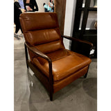 A sleek seat with hidden push-back reclining functionality. This midcentury-inspired recliner features wide chunky channeling paired with slim paddle arms and a tapered wood frame. Designed with a high seat and high back for extra comfy support. Upholstered in a timeless tobacco-hued leather made in a family-owned tannery in Thailand. Amethyst Home provides interior design, new home construction design consulting, vintage area rugs, and lighting in the Alpharetta metro area.