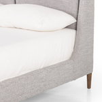 Light, livable luxury. Upholstered in a grey synthetic-blend, a tapered headboard features fixed overscale pillows, for a calming look with great depth. Wire-brushed parawood legs lend a warm, natural finishing touch. Performance fabrics are specially created to withstand spills, stains, high traffic and wear, ensuring long-term comfort and unmatched durability. Amethyst Home provides interior design, new home construction design consulting, vintage area rugs, and lighting in the Laguna Beach metro area.