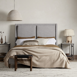 Light, livable luxury. Upholstered in a grey synthetic-blend, a tapered headboard features fixed overscale pillows, for a calming look with great depth. Wire-brushed parawood legs lend a warm, natural finishing touch. Performance fabrics are specially created to withstand spills, stains, high traffic and wear, ensuring long-term comfort and unmatched durability. Amethyst Home provides interior design, new home construction design consulting, vintage area rugs, and lighting in the Monterey metro area.