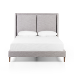 Light, livable luxury. Upholstered in a grey synthetic-blend, a tapered headboard features fixed overscale pillows, for a calming look with great depth. Wire-brushed parawood legs lend a warm, natural finishing touch. Performance fabrics are specially created to withstand spills, stains, high traffic and wear, ensuring long-term comfort and unmatched durability. Amethyst Home provides interior design, new home construction design consulting, vintage area rugs, and lighting in the Los Angeles metro area.