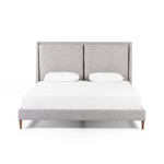Light, livable luxury. Upholstered in a grey synthetic-blend, a tapered headboard features fixed overscale pillows, for a calming look with great depth. Wire-brushed parawood legs lend a warm, natural finishing touch. Performance fabrics are specially created to withstand spills, stains, high traffic and wear, ensuring long-term comfort and unmatched durability. Amethyst Home provides interior design, new home construction design consulting, vintage area rugs, and lighting in the Charlotte metro area.