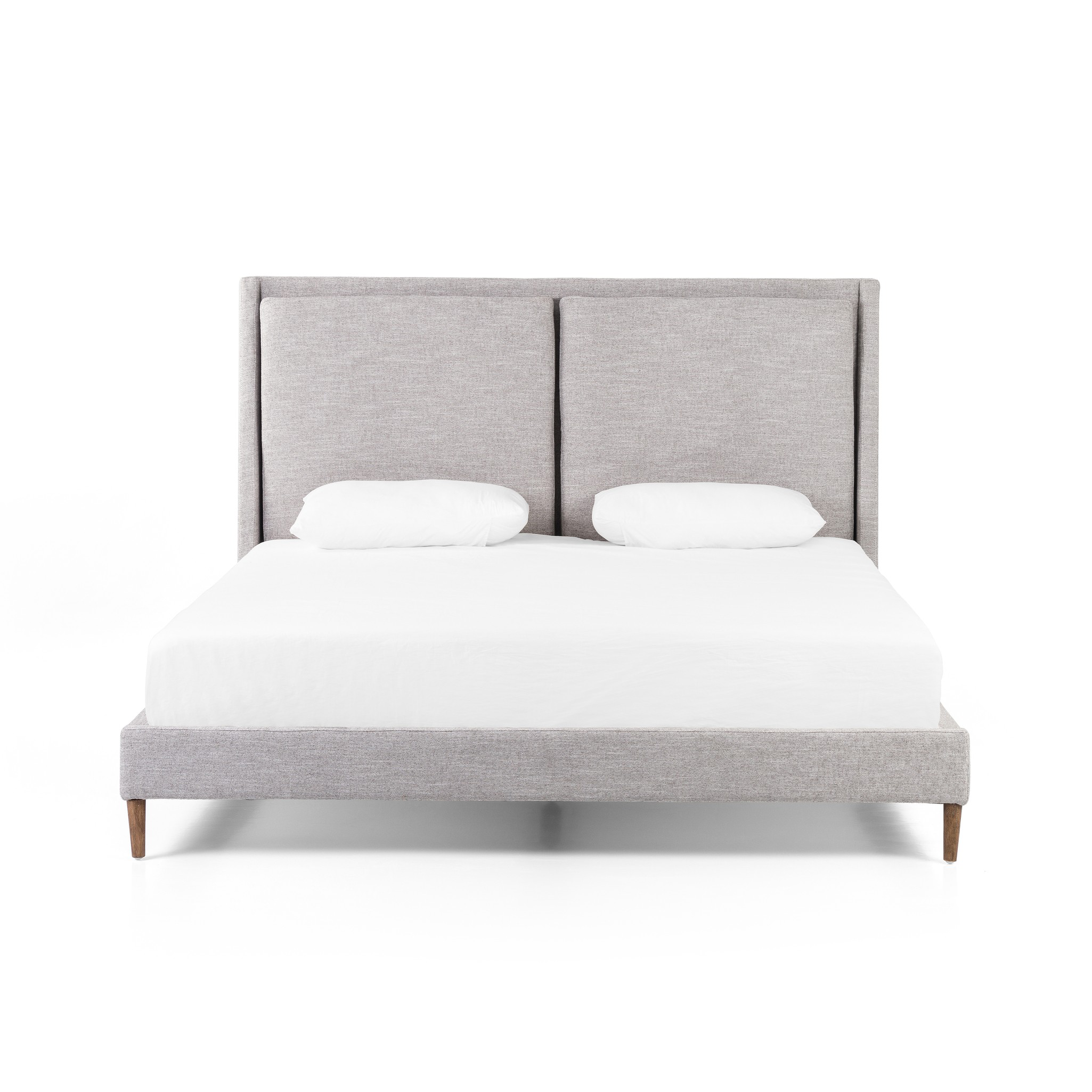 Light, livable luxury. Upholstered in a grey synthetic-blend, a tapered headboard features fixed overscale pillows, for a calming look with great depth. Wire-brushed parawood legs lend a warm, natural finishing touch. Performance fabrics are specially created to withstand spills, stains, high traffic and wear, ensuring long-term comfort and unmatched durability. Amethyst Home provides interior design, new home construction design consulting, vintage area rugs, and lighting in the Charlotte metro area.