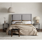 Light, livable luxury. Upholstered in a grey synthetic-blend, a tapered headboard features fixed overscale pillows, for a calming look with great depth. Wire-brushed parawood legs lend a warm, natural finishing touch. Performance fabrics are specially created to withstand spills, stains, high traffic and wear, ensuring long-term comfort and unmatched durability. Amethyst Home provides interior design, new home construction design consulting, vintage area rugs, and lighting in the Park City metro area.