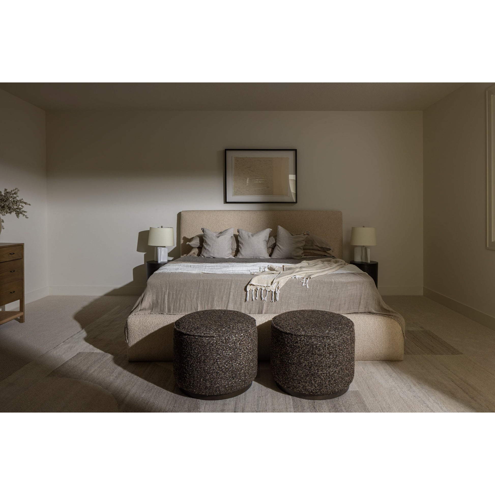 Modern, clean shaping meets inflated comfort with this padded, upholstered bed frame in a textural boucle-like pattern.  Text(251) 257-7986 for quick product details.Overall Dimensions: 92.25"W x 89.25"L x 48"H Amethyst Home provides interior design, new home construction design consulting, vintage area rugs, and lighting in the Omaha metro area.