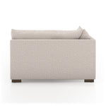 Featuring Westwood Sectional Pieces - Bayside Pebble by Four Hands at Amethyst Home. Meet the ultimate modular lounger. Knife edge cushioning is upholstered in a stone-colored high-performance fabric, perfect for modern living. Ottoman piece to matching sectional. Performance fabrics are specially created to withstand spills, stains, high traffic and wear,.  Amethyst Home provides interior design, new home construction design consulting, vintage area rugs, and lighting in the Park City metro area.