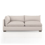 Featuring Westwood Sectional Pieces - Bayside Pebble by Four Hands at Amethyst Home. Meet the ultimate modular lounger. Knife edge cushioning is upholstered in a stone-colored high-performance fabric, perfect for modern living. Ottoman piece to matching sectional. Performance fabrics are specially created to withstand spills, stains, high traffic and w.  Amethyst Home provides interior design, new home construction design consulting, vintage area rugs, and lighting in the Newport Beach metro area.