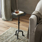 Formed from cast metal with a textured black finish, with turning details on the post for visual interest. Three curved legs are inspired by classic antique metal tables. Amethyst Home provides interior design, new home construction design consulting, vintage area rugs, and lighting in the Des Moines metro area.