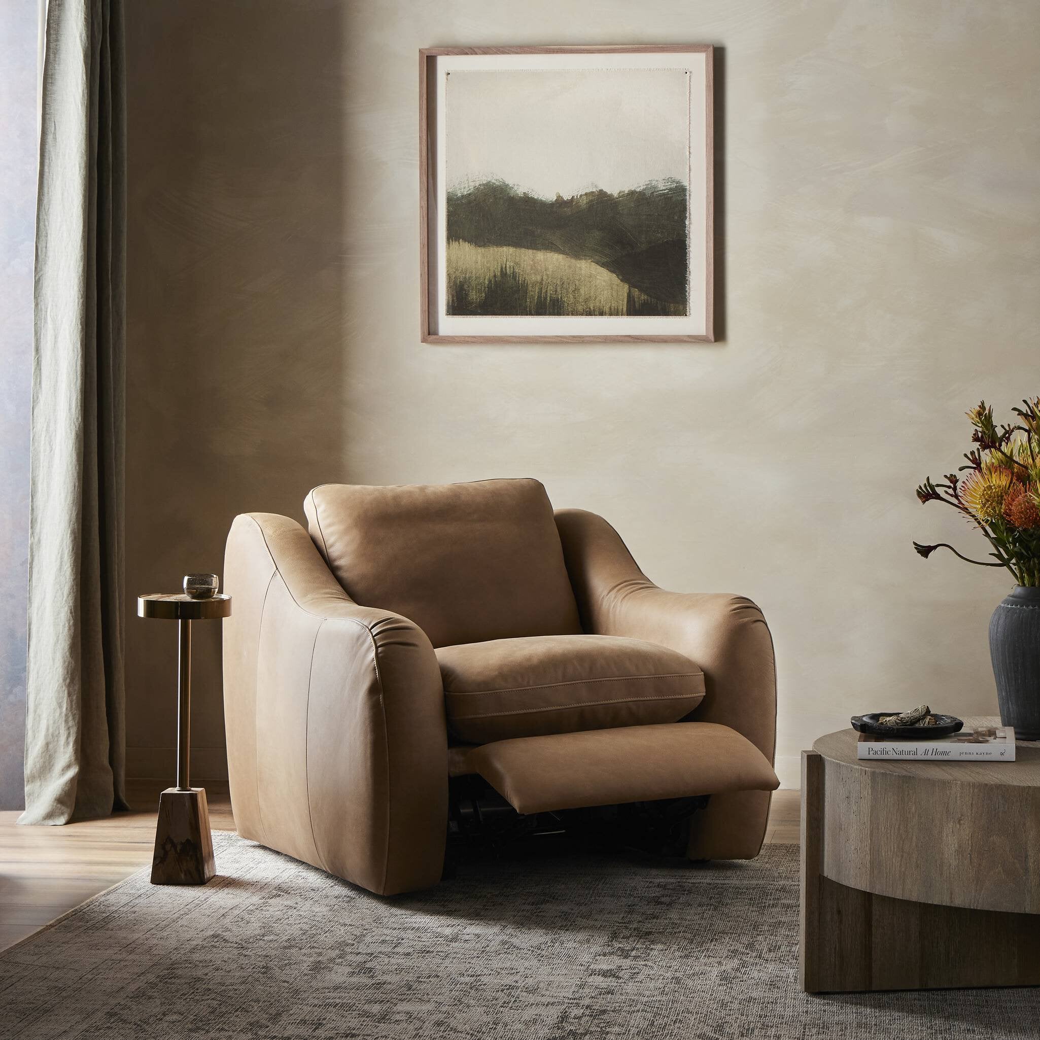 A modern take on the classic recliner. Customize your comfort level with the push of hidden buttons with pieces in our Power Motion collection. Made from caramel top-grain leather, with fiber-and-feather blend cushions plus web suspension for a plush, sink-in experience. A deployable footrest meets luxury with comfort.Overall Dimensions: 41.00"w x 41.00"d x 37. Amethyst Home provides interior design, new home construction design consulting, vintage area rugs, and lighting in the Alpharetta metro area.