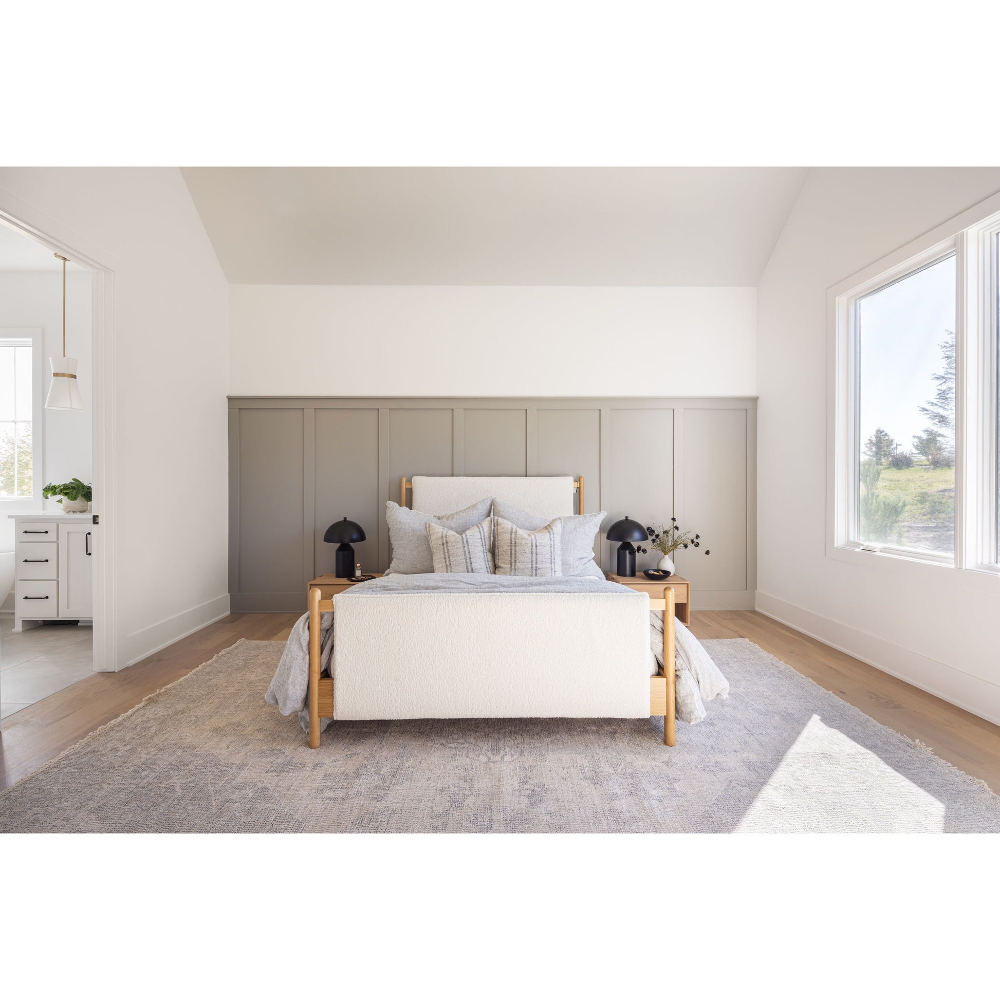 Bring a cozy hygge vibe to the bedroom with this textured Bowen Bed. Framed by light-finished solid oak, a sling-style bed features faux shearling head and foot boards -- sure to elevate any bedroom. Amethyst Home provides interior design, new home construction design consulting, vintage area rugs, and lighting in the Omaha metro area.