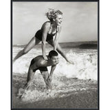 Young Couple Playing Leapfrog in Surf Art - 16 x 20