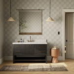 Set the tone for a calming, peaceful space with this simple, yet spacious design. Crafted with a wire-brushed, thick oak veneer base in a black wash finish for added character, a Carrera marble top and solid brass hardware. A mix of drawers, cabinets and open shelving offers a variety of storage and styling options. Finished with a bath-safe sealant for moisture resistance. Amethyst Home provides interior design, new construction, custom furniture, and area rugs in the Seattle metro area
