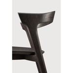 Over the years, the Bok dining chair has become one of our most recognisable designs. Designer Alain van Havre combines sculptural elegance and contemporary crafting into a graceful and airy form.

Seating height: 46cm - 18".
Made from brown tainted oak with a varnish finish. Amethyst Home provides interior design, new construction, custom furniture, and area rugs in the Kansas City metro area