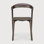 Over the years, the Bok dining chair has become one of our most recognisable designs. Designer Alain van Havre combines sculptural elegance and contemporary crafting into a graceful and airy form.

Seating height: 46cm - 18".
Made from brown tainted oak with a varnish finish. Amethyst Home provides interior design, new construction, custom furniture, and area rugs in the Seattle metro area