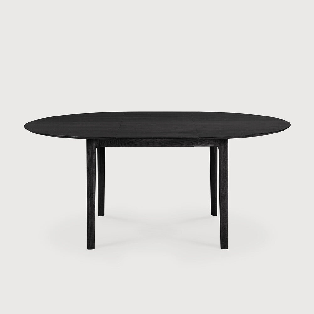 Reminiscent of a goat's curved horns, the Bok collection combines sculptural elegance and contemporary crafting into a graceful and airy form. The Bok solid oak round extendable dining table offers the perfect solution for adaptable dining within a smaller space. With an internally housed extension, the round four-seater easily adapts for more people. Amethyst Home provides interior design, new construction, custom furniture, and area rugs in the Nashville metro area