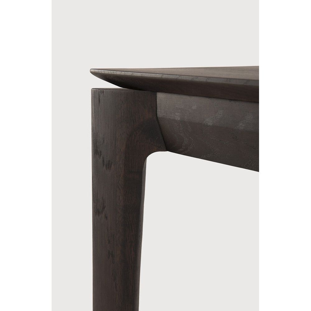 Featuring Bok Oak Brown Bench by Ethnicraft at Amethyst Home. Reminiscent of a goat's curved horns, the Bok collection combines sculptural elegance and contemporary crafting into a graceful and airy form. The Bok bench pairs well with the Bok dining table, but also as a stand-alone against a wall, in a hallway or at the end of a bed.Collection : BokFinish : VarnishedFloor Protect. Amethyst Home provides interior design, new construction, custom furniture, and area rugs in the Scottsdale metro area