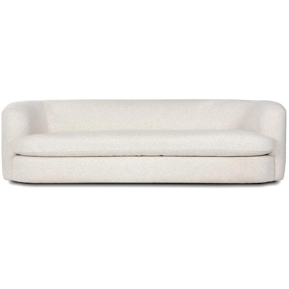 Featuring Clarissa Sofa by Four Hands at Amethyst Home. Organic curves with a dreamy French inspired boucle fabric -- the Clarissa sofa is an Amethyst favorite.  The sleek single seat cushion with firm back provides luxe comfort.
Overall Dimensions: 95.00"w x 37.50"d x 27.50"hWeight : 131.39 lbMaterials : 47% Polyester, 18% Viscose, 30% Acrylic, 5% Linen. Amethyst Home provides interior design, new home construction design consulting, vintage area rugs, and lighting in the Laguna Beach metro area.