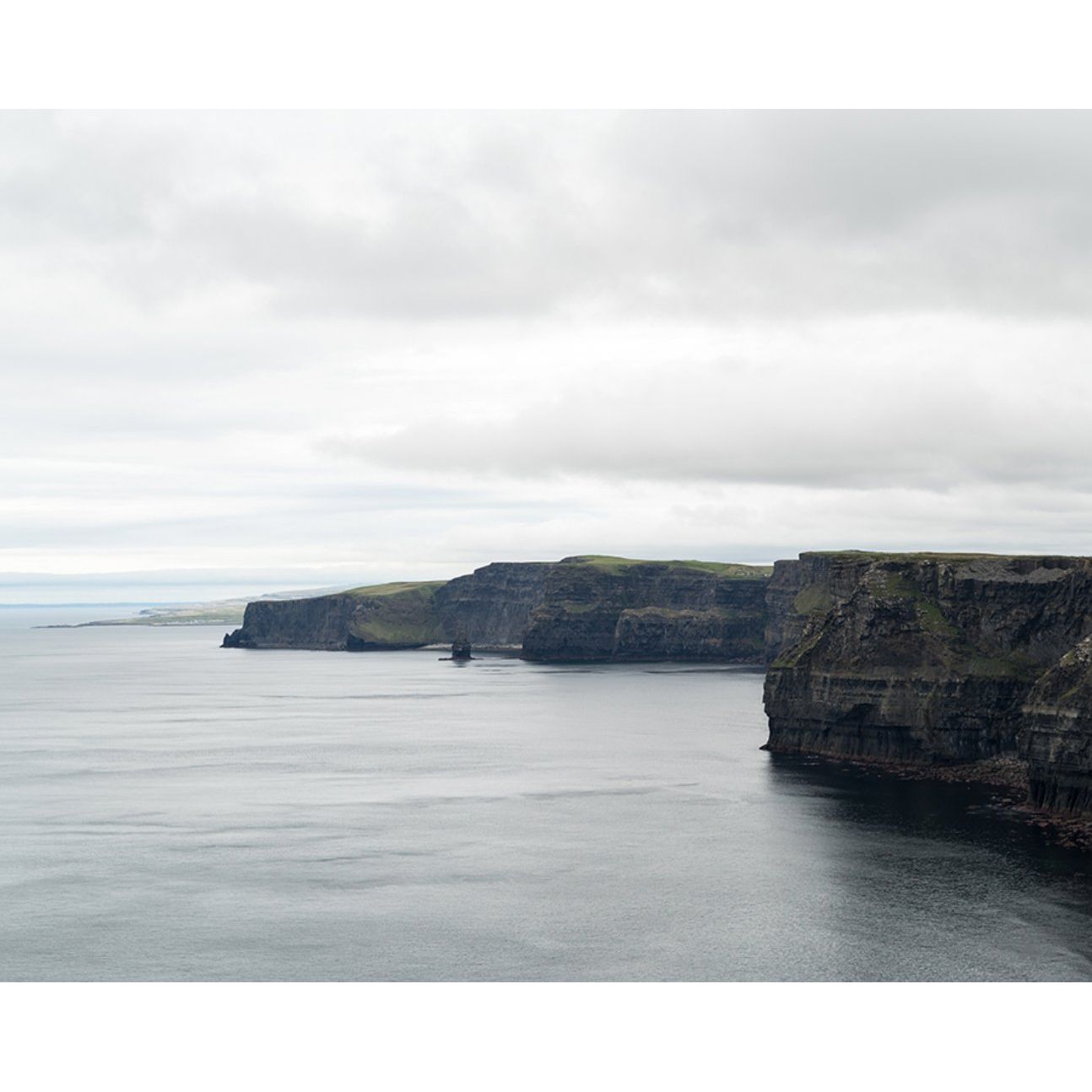 Featuring Cliffs of Moher Art by Leftbank Art at Amethyst Home. Instant zen and yearning of travel when we look at this Cliffs of Moher Art. Both large in size and in beauty, we'd love to see this hung over a sofa or displayed in a dining room! 
Artist: Tommy Kwak Product Type: GicléeFinish: MatteSize: 60" x 48"
  Framed as shown.  Amethyst Home provides interior design, new home construction design consulting, vintage area rugs, and lighting in the Alpharetta metro area.
